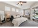 Relaxing main bedroom features lots of natural light, access to the backyard, and a calming color palette at 6523 Blue Grosbeak Cir, Lakewood Ranch, FL 34202