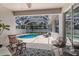 Relaxing screened lanai with a sparkling blue pool and outdoor seating at 6523 Blue Grosbeak Cir, Lakewood Ranch, FL 34202