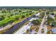 Panoramic aerial shot capturing waterfront condos with lush landscaping and the adjacent pristine golf course at 7391 W Country Club N Dr, Sarasota, FL 34243