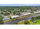 Beautiful aerial shot overlooking waterfront condos surrounded by lush landscaping and mature trees at 7391 W Country Club N Dr, Sarasota, FL 34243