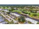 Aerial view of the community, highlighting the golf course, ponds, and surrounding area at 7391 W Country Club N Dr, Sarasota, FL 34243
