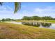 Beautiful backyard view overlooking the pond and golf course at 7391 W Country Club N Dr, Sarasota, FL 34243