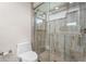 Bathroom featuring a modern shower with glass door, tiled walls and floors, and updated fixtures at 7391 W Country Club N Dr, Sarasota, FL 34243