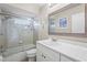 Clean bathroom featuring a new marble vanity top and tiled shower and tub at 7391 W Country Club N Dr, Sarasota, FL 34243