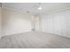 Bedroom with light grey carpet, walk-in closet and ensuite door access at 7391 W Country Club N Dr, Sarasota, FL 34243