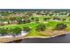 Picturesque golf course view featuring a lush green landscape with mature trees and water features, perfect for recreation at 7391 W Country Club N Dr, Sarasota, FL 34243