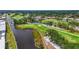 Scenic view of the golf course highlighting lush greens, mature trees, and a tranquil water feature, ideal for relaxation at 7391 W Country Club N Dr, Sarasota, FL 34243