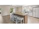 Bright kitchen with stainless steel appliances, granite countertops, and a breakfast bar with seating at 7391 W Country Club N Dr, Sarasota, FL 34243