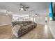 Open concept living room featuring neutral tile flooring, recessed lights, and modern ceiling fans at 7391 W Country Club N Dr, Sarasota, FL 34243