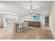 Open living space with bright white cabinets and granite counters and bar stool seating at 7391 W Country Club N Dr, Sarasota, FL 34243