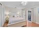 Well lit bedroom boasts wood floors, neutral colors, closet space, and sliding door to screened porch at 801 E 5Th St, Englewood, FL 34223