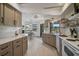 Spacious kitchen featuring marble countertops, neutral-toned cabinets, and a dining nook with outdoor views at 801 E 5Th St, Englewood, FL 34223