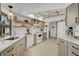 Updated kitchen featuring stainless steel appliances, marble countertops, and neutral-toned cabinetry at 801 E 5Th St, Englewood, FL 34223