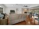 Spacious living area with fireplace, hardwood floors, comfortable seating, and view of pool area at 801 E 5Th St, Englewood, FL 34223