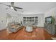 Large living room featuring hardwood floors, neutral colors, comfortable seating, and a bright, inviting atmosphere at 801 E 5Th St, Englewood, FL 34223
