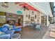 Enjoy a relaxing seating area on this covered patio with an outdoor kitchen and access to the pool and interior at 801 E 5Th St, Englewood, FL 34223