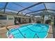 This pool area features a covered area, bar, hammock, and plenty of lounge space for parties and relaxation at 801 E 5Th St, Englewood, FL 34223