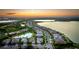 Sunset aerial view showcasing the home's location with lake views at 801 Seascape Pl, Sarasota, FL 34240