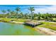 Aerial view of lakefront community deck overlooking the water and lush landscaping at 801 Seascape Pl, Sarasota, FL 34240