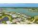 Expansive aerial view showing the home near community lakes, lush landscaping, and neighborhood layout at 801 Seascape Pl, Sarasota, FL 34240