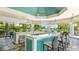 Beautifully designed outdoor bar area with seating, stylish countertops, and scenic views at 801 Seascape Pl, Sarasota, FL 34240