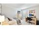 Relaxing bedroom with desk, cozy decor, natural light, and neutral tones at 801 Seascape Pl, Sarasota, FL 34240