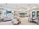 Spacious community room with comfortable seating, kitchen, and elegant decor at 801 Seascape Pl, Sarasota, FL 34240