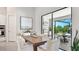 Cozy dining area with modern furnishings, sliding glass doors to the patio, and natural light at 801 Seascape Pl, Sarasota, FL 34240