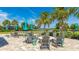 Community fire pit area with chairs and lake views at 801 Seascape Pl, Sarasota, FL 34240