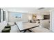 Spacious game room featuring a ping pong table, comfortable seating, and stylish decor at 801 Seascape Pl, Sarasota, FL 34240