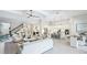 Spacious open-concept living area with a modern kitchen, dining area, and stylish furniture at 801 Seascape Pl, Sarasota, FL 34240