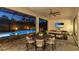 Stylish outdoor living space with a pool, dining area, and comfortable seating at 801 Seascape Pl, Sarasota, FL 34240