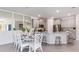 Bright kitchen with granite countertops, stainless steel appliances, modern cabinets, and dining area at 805 157Th E Ct, Bradenton, FL 34212