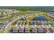 New construction homes with ponds, sidewalks, and community landscaping, forming an attractive neighborhood at 8612 Evening Dr, Sarasota, FL 34241