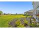Expansive backyard with beautiful pond view and lush landscaping perfect for relaxing at 8612 Evening Dr, Sarasota, FL 34241