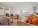 Comfortable upstairs bonus room/office with desk, daybed, and plenty of natural light at 8612 Evening Dr, Sarasota, FL 34241