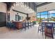 Modern clubhouse with a bar, seating, and views of the community at 8612 Evening Dr, Sarasota, FL 34241