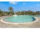 Stunning view of the large community pool featuring a water slide and lush tropical landscaping at 8612 Evening Dr, Sarasota, FL 34241