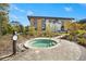 Inviting outdoor hot tub nestled within landscaped grounds, near a modern building and walking path at 8612 Evening Dr, Sarasota, FL 34241
