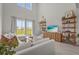 Bright, modern living room with high ceilings, large windows, and stylish decor at 8612 Evening Dr, Sarasota, FL 34241