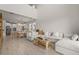 Bright, open-concept living room, kitchen, and dining area features modern furnishings and elegant decor at 8612 Evening Dr, Sarasota, FL 34241
