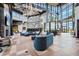 Luxury building lobby with climbing wall, modern decor, comfortable seating, and abundant natural light at 8612 Evening Dr, Sarasota, FL 34241