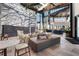 Inside the clubhouse there is a large rock climbing wall, seating, and high ceilings with natural light at 8612 Evening Dr, Sarasota, FL 34241