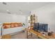 Cozy loft space with a daybed, a desk, and natural light at 8612 Evening Dr, Sarasota, FL 34241