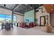 Well-designed lounge area featuring stylish furniture, a large window, and modern decor at 8612 Evening Dr, Sarasota, FL 34241