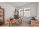 Bright home office with desk, shelving and lots of natural light at 8612 Evening Dr, Sarasota, FL 34241