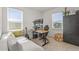 Comfortable office space featuring a sofa, desk, and triple monitors at 8612 Evening Dr, Sarasota, FL 34241