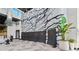 A large rock climbing wall indoor with a padded area and chairs provides a fun and active space at 8612 Evening Dr, Sarasota, FL 34241