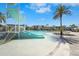 Fun water slide feature in the community pool area, set against a backdrop of modern architecture and palm trees at 8612 Evening Dr, Sarasota, FL 34241