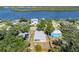 Charming waterfront property with well-maintained landscaping and serene river views at 1010 Tropical Dr, Bradenton, FL 34208